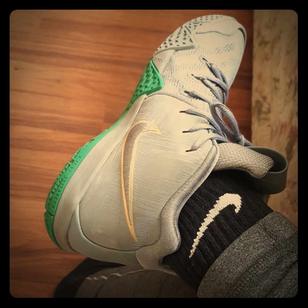 Kyrie 4s in grey